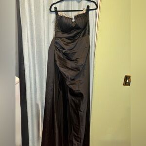 black evening dress with a sweetheart neckline and crystal embellishments